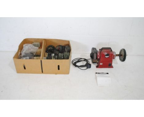 A Creusen dual bench grinder with polishing wheels, accessories and instructions