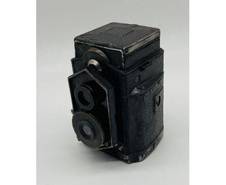 A vintage Zeiss Ikon 'Coffee Can' Ikoflex camera