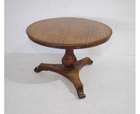 An early Victorian mahogany breakfast table raised on tripod base - diameter 95cm, height 70cm