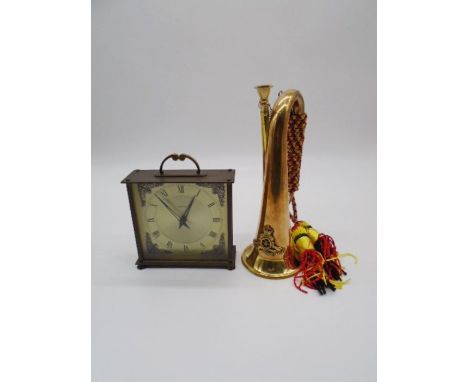 A copper and brass bugle with the Royal Artillery crest, plus an eight day floating balance clock by Smiths.