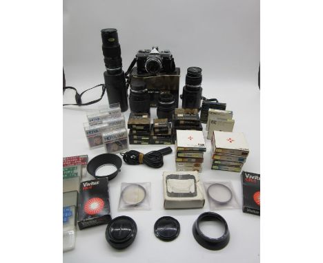 An Olympus OM-1 camera along with various Olympus lenses (55mm, 100mm and 150mm), a Hanimax 200mm lens and numerous Hoya and 