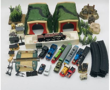 A collection of various railway related toys including a ERTL Thomas the Tank Engine and Friends set, LMS OO gauge maroon str