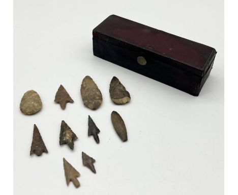A collection of flint arrow heads (possibly Neolithic?) along with a leather stationary box made by H Rodrigues, Piccadilly