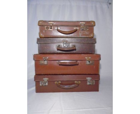 Four vintage worn leather suitcases. Largest 45cm x 29cm x 12cm. 