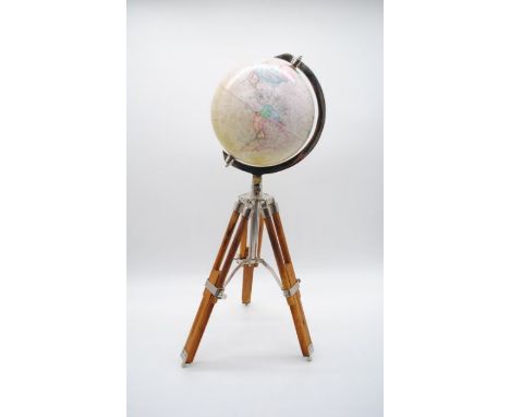 A vintage globe on tripod stand