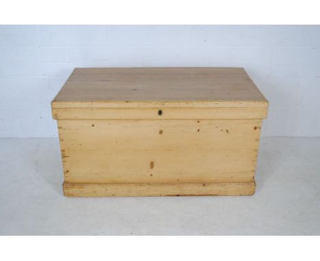 A vintage large pine trunk with interior drawers - length 110cm, depth 58cm, height 60cm