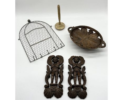 A pair of antique carved wooden panels along with a wirework panel with hooks etc.