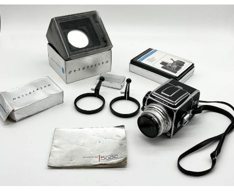 A Hasselblad 500C camera with Carl Zeiss planar 1:2.8 F+80mm lens no. 4595461 along with a boxed Hasselblad Professional lens