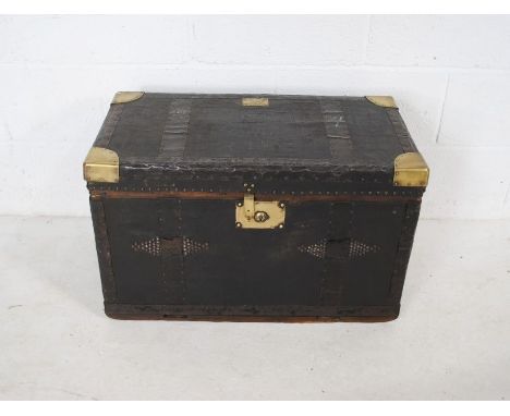 A 'Maynard &amp; Harris' brass bound military trunk with stud-work decoration