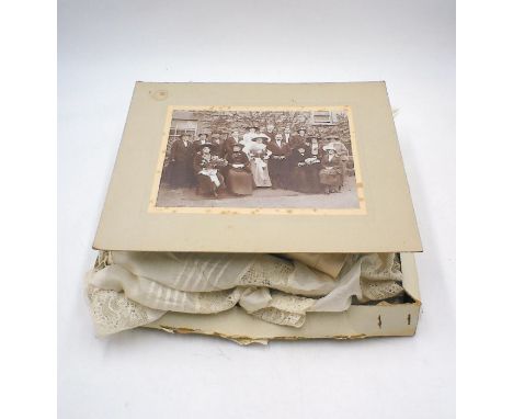 Three turn of the century fabrics including two christening robes and a bride's lace and silk blouse this lot also contains a