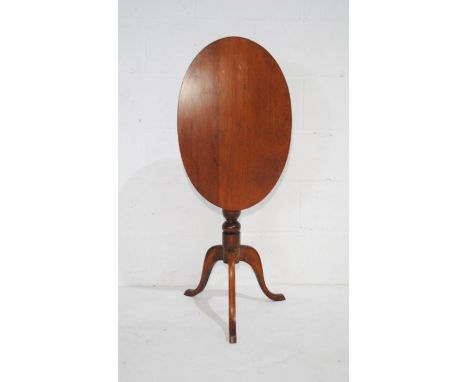 A Georgian mahogany oval tip-up tripod table (A/F)