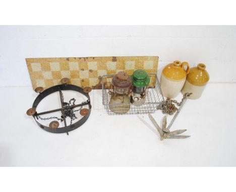 A mixed lot including a folding boat anchor, Colemans Tilley lamp and one other, two stoneware jugs, a wrought iron candelabr