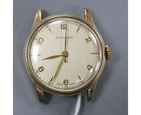 A gentleman's 9ct. gold Longines manual wind wrist watch, with baton &amp; Arabic numerals (strapless).