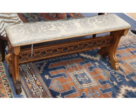 A 19th century Italian walnut Gothic revival stool W.104cm