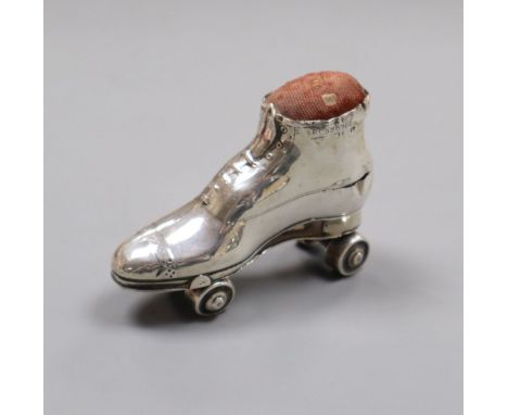 An Edwardian novelty silver mounted roller skate pin cushion, Crisford &amp; Norris, Birmingham, 1909, 7cm.