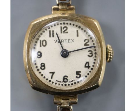 A lady's 9ct gold manual wind wrist watch, on a 9ct gold expanding bracelet.