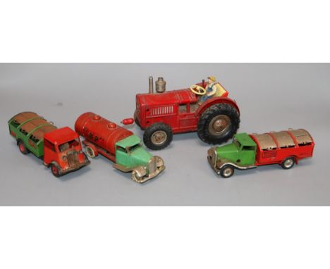 Three Minic trucks and a German tractor