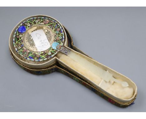 A Chinese white metal and enamel tea strainer, with pierced jade handle, 22cm.