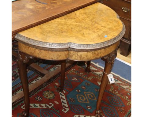 A Queen Anne style walnut demi-lune card table W.91cm