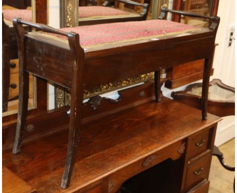 An Edwardian mahogany box seat duet piano stool