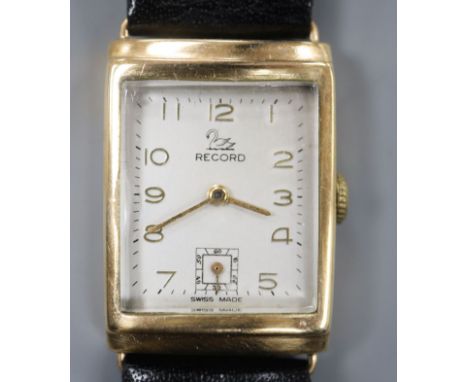 A gentleman's 1950's 9ct gold Record manual wind wrist watch, with rectangular Arabic dial and subsidiary seconds, on associa