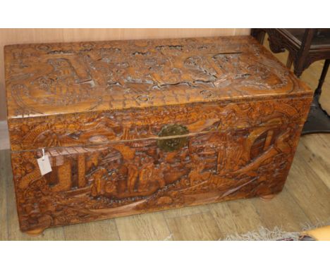 A Chinese carved camphorwood trunk L.105cm