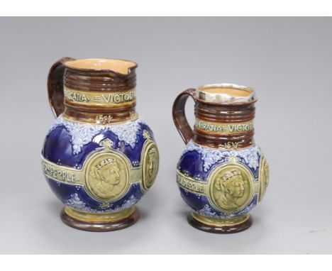 Two Doulton Lambeth graduated Queen Victoria Diamond Jubilee commemorative jugs, c.1896/7, with portrait medallions of the yo