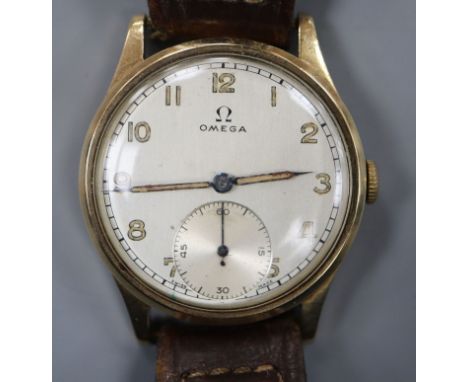 A gentleman's 1950's? 9ct. gold Omega manual wind wrist watch, with Arabic dial and subsidiary seconds, on associated strap.