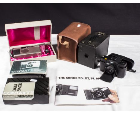 A Contax T2 camera and accessories, a Kodak box Brownie together with a Minox 35 camera
