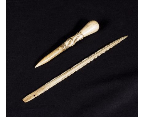 An ethnic bone fishing spear and a bone tool