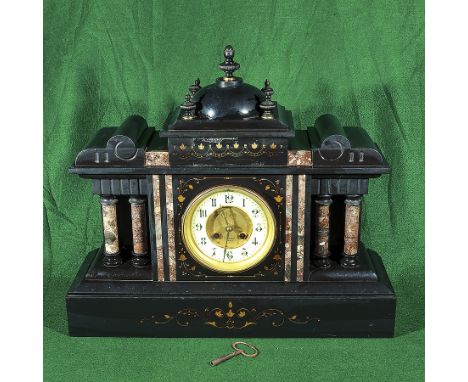 A Victorian black slate mantle clock
