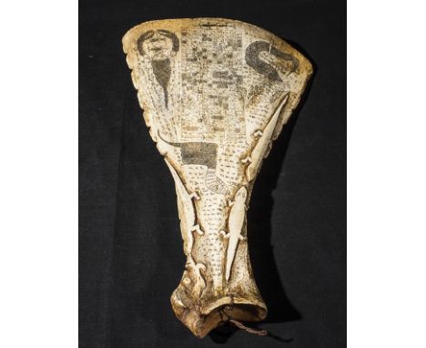 An unusual South Seas engraved and carved bone club