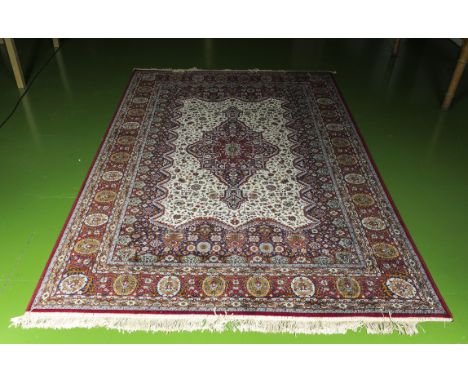 A large red ground wool carpet