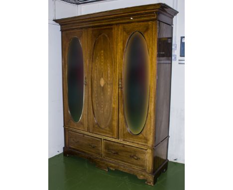 An Edwardian inlaid two door wardrobe