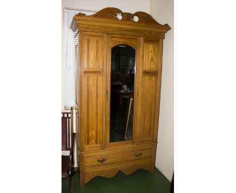 A late Victorian Arts and Crafts style ash single door wardrobe