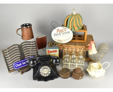 A Collection of Various Sundries to Comprise Wicker Hamper, Chicken Ornament, Olde Village Breakfast Oats Tin, Cast Iron Reci
