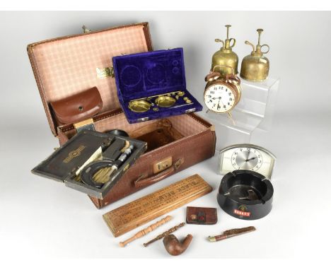 A Vintage Travelling Case Containing Various Items to Comprise Alarm Clocks, Banks Advertising Ashtray, Black Bell Cribbage B