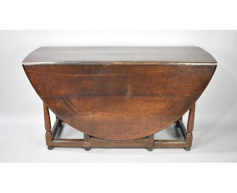 An Oak Drop Leaf Gate Leg Wake Table with Oval Top and Single End Drawer , 148cm Long 