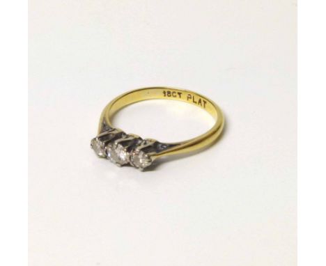 A diamond three stone 18ct gold ring, total diamond weight approximately 0.25 carot, size K No condition reports for this sal