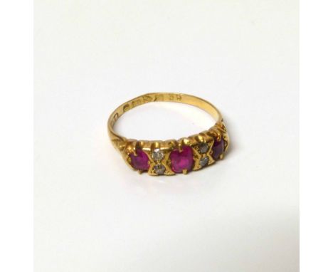 A ruby and diamond set 18ct gold boat head ring size L No condition reports for this sale