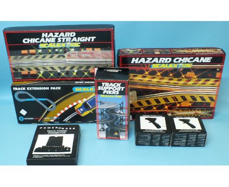Scalextric: two hazard chicane sets, track extension pack, track support piers, two hand throttles and track power connector,