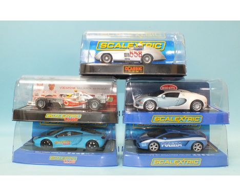 Five modern Scalextric cars by Hornby Hobbies Ltd, all in plastic boxes.