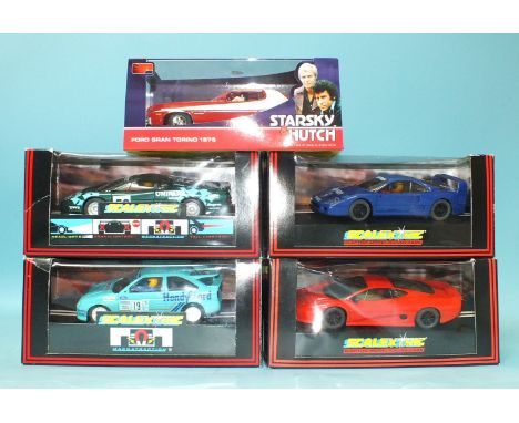 Five modern Scalextric cars by Hornby Hobbies Ltd, all boxed.