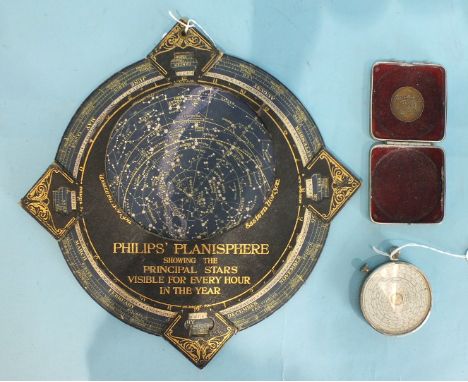 A Philips Planisphere showing the principal stars visible for every hour in the year, on card backing, George Philip & Son Lt