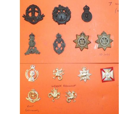 A large collection of Staybright British Army cap badges, including Royal Army Chaplain badges, Christian and Jewish, almost 