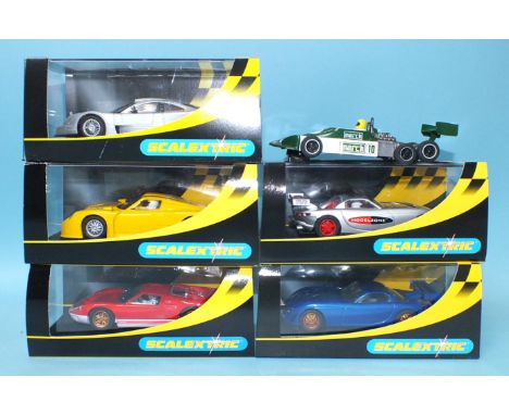 Five modern Scalextric sports cars, all boxed, one unboxed Grand Prix car, and three Matchbox SCX cars, boxed, (9).