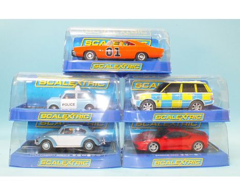 Five modern Scalextric cars by Hornby Hobbies Ltd, all in plastic boxes.