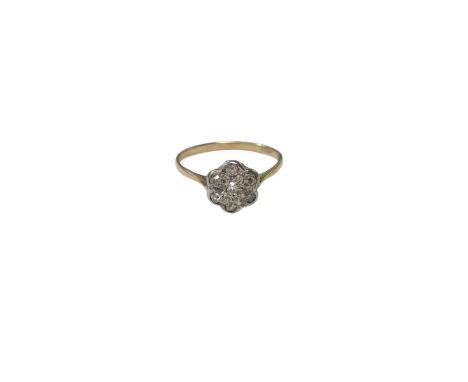 Antique diamond daisy cluster ring set with seven old cut diamonds in a platinum setting on an 18ct gold shank, size M½Weight