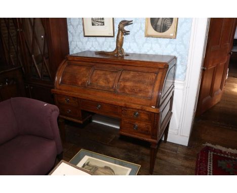 A French walnut bureau de cylinder, late 19th Century, with triple panel fall over a fitted interior and an arrangement of fi