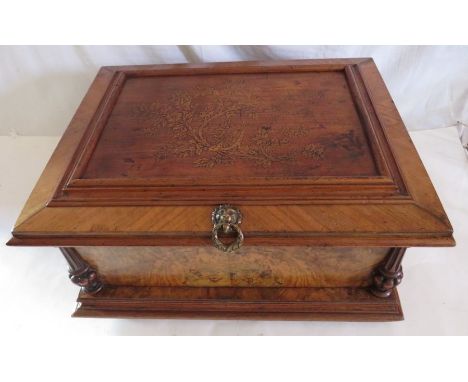 A Victorian walnut cased symphonium in table top case with foliate inlaid&nbsp; panel, twin carrying handles. 26cm h x 49cm w